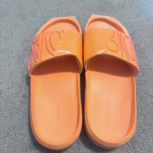 Jordan Women's Orange Slide Sandals, men’s 7, women’s 9